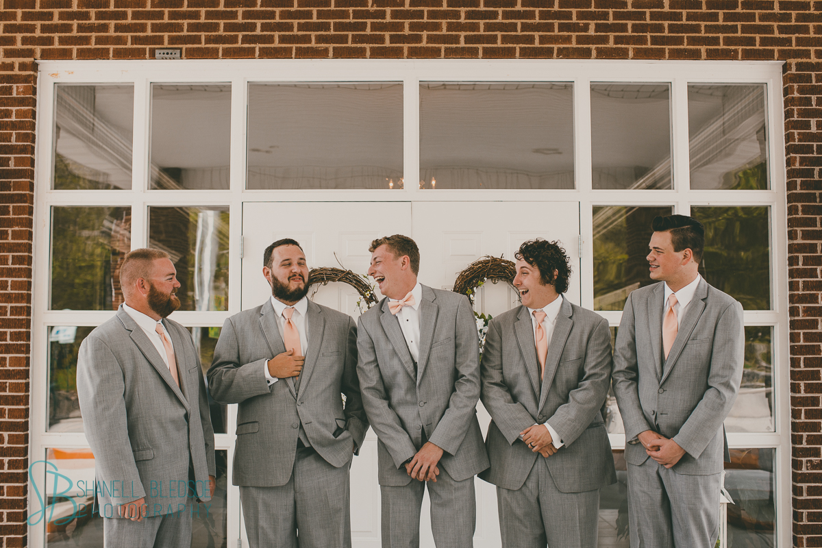Gray suit peach tie groomsmen in church wedding knoxville lafollette tn photography