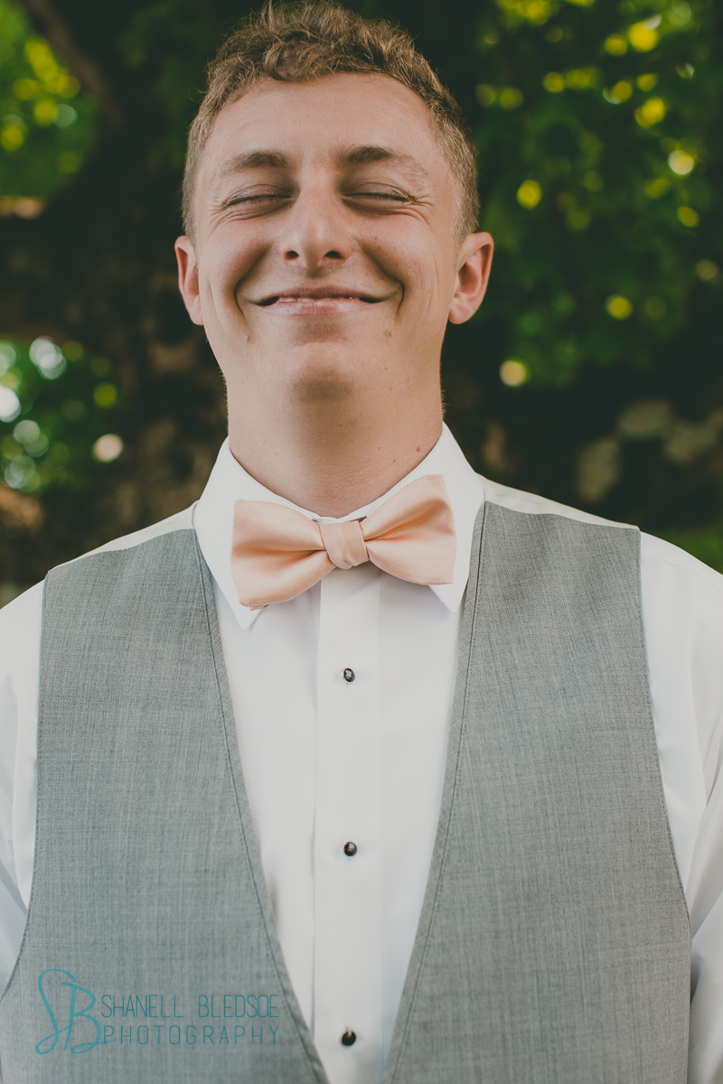 Gray suit peach tie groom in church wedding knoxville lafollette tn photography