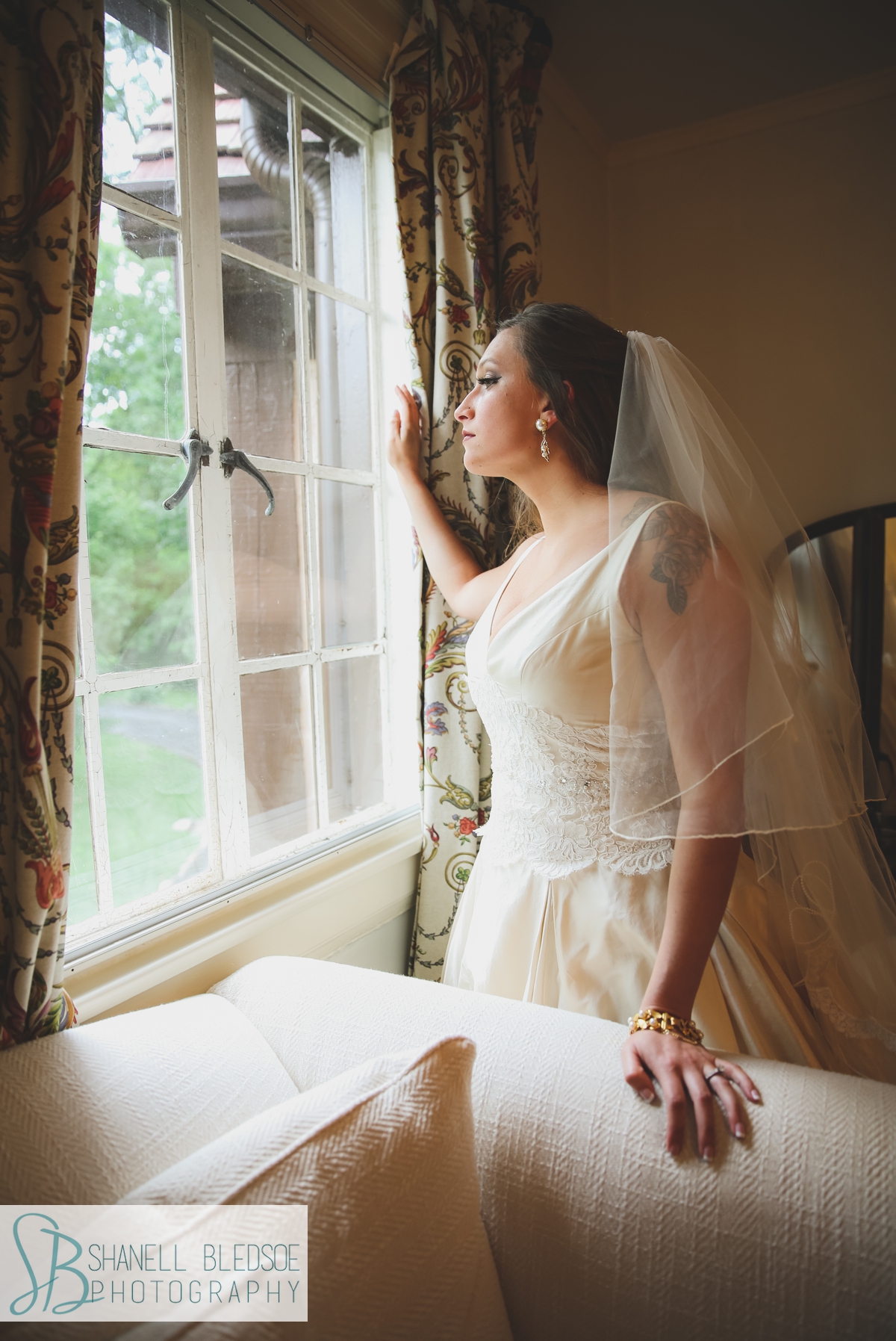 bride looking out window at grandview chattanooga
