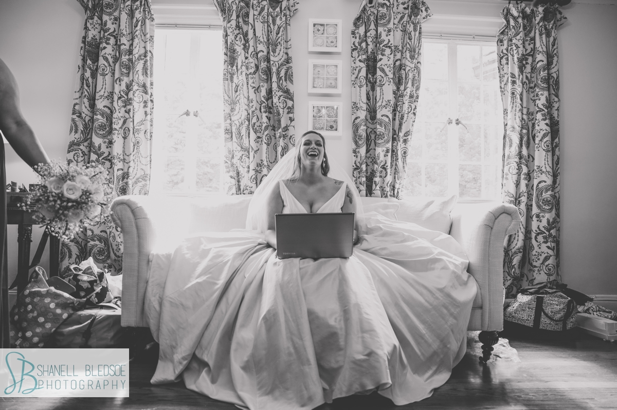 bride laughing with laptop computer at grandview 