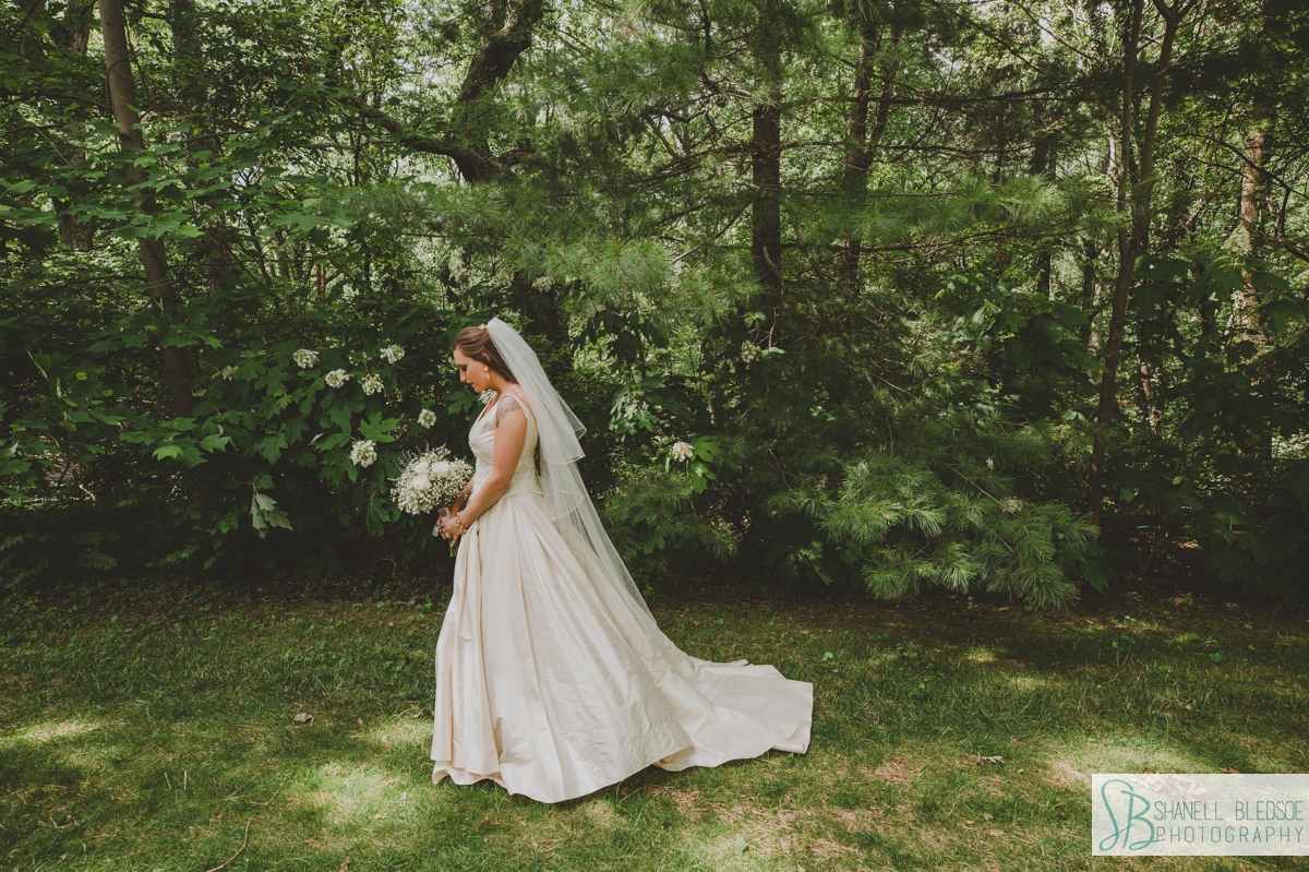 bridal portrait on lawn with lavender bouquet at Grandview Chattanooga