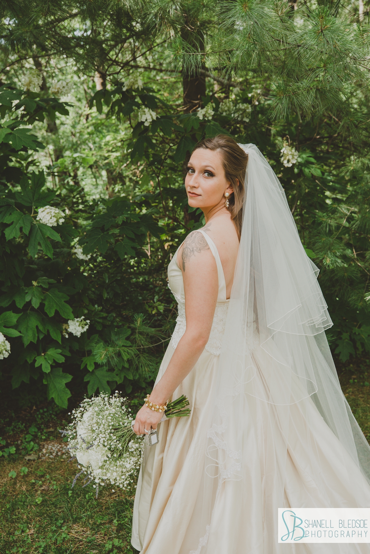 bridal portrait on lawn with lavender bouquet at Grandview Chattanooga