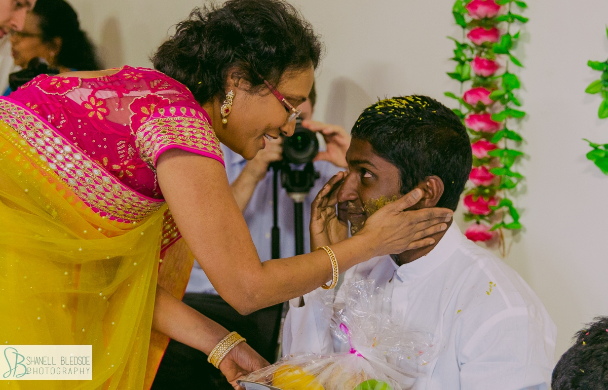 aunt blessing the groom at Haldi pithi