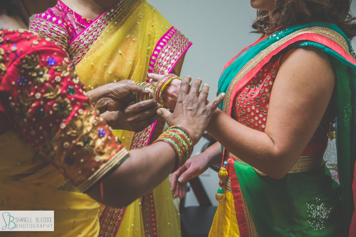 Putting bangles on wrist of Indian bride nashville