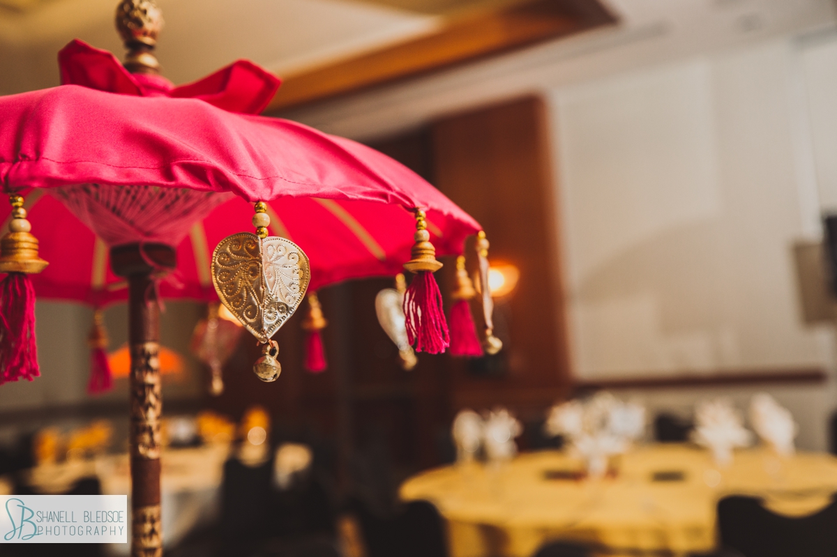 Indian sangeet mandap by red umbrella inc fuchsia umbrella table centerpiece