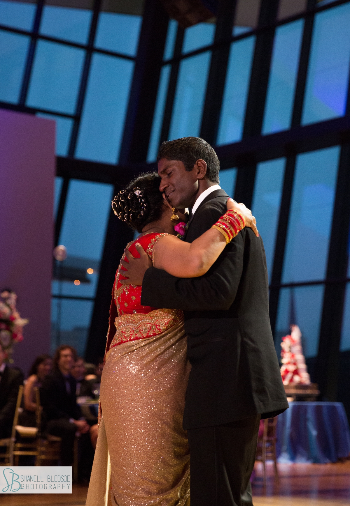 Indian groom dancing with mother at country music hall of fame