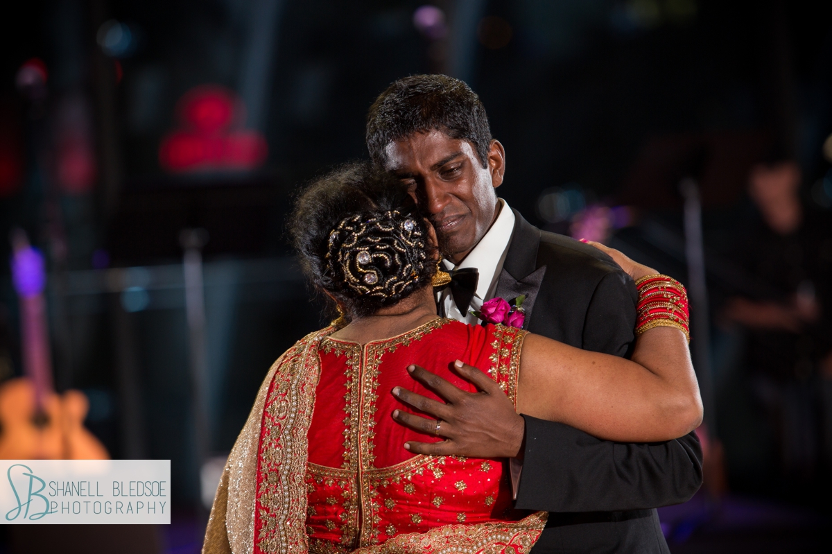 crying Indian groom dancing with mother at country music hall of fame