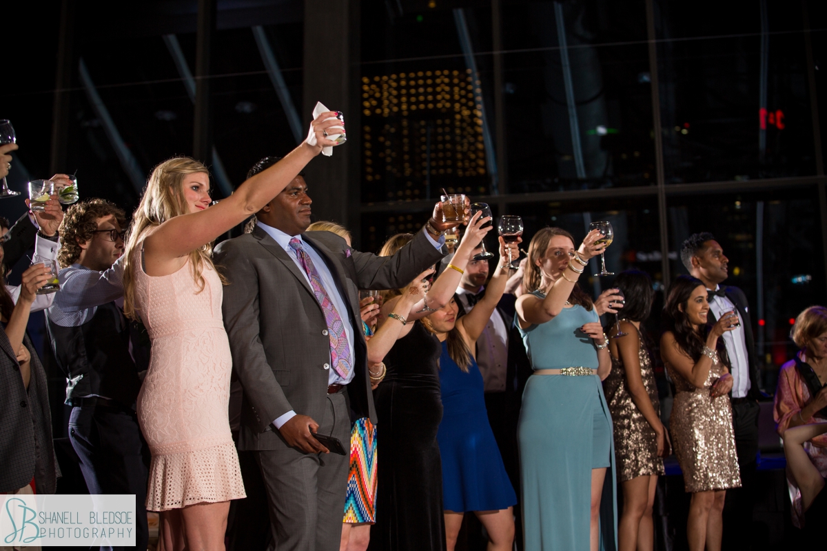guests toast to the bride and groom at country music hall of fame Indian wedding reception