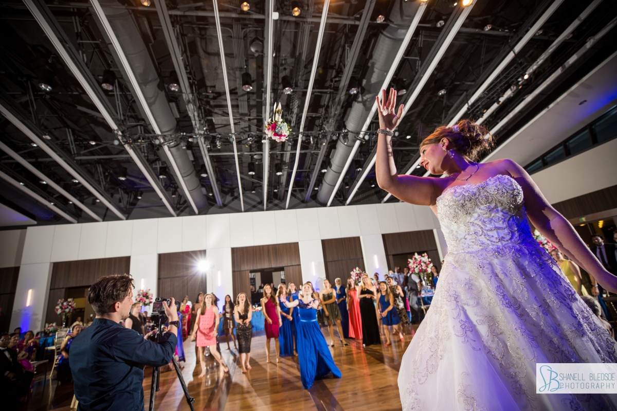 bouquet toss at country music hall of fame wedding reception