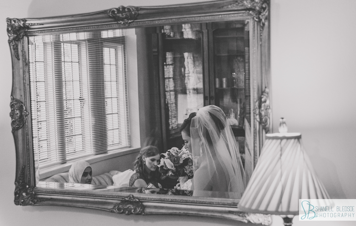 bride's reflection in mirror before wedding at Scarritt Bennett in Nashville