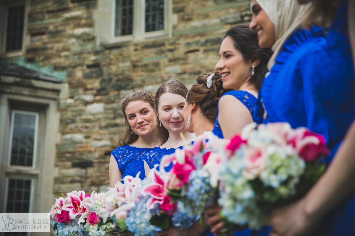 bride and bridesmaids outside Scarritt Bennett wedding royal blue hot pink