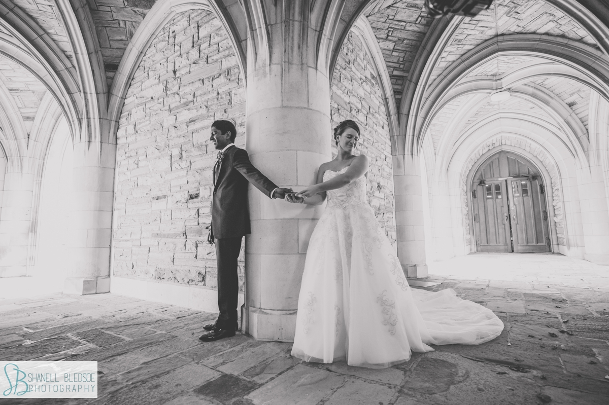 first touch bride and groom under arches at Scarritt Bennett Nashville wedding