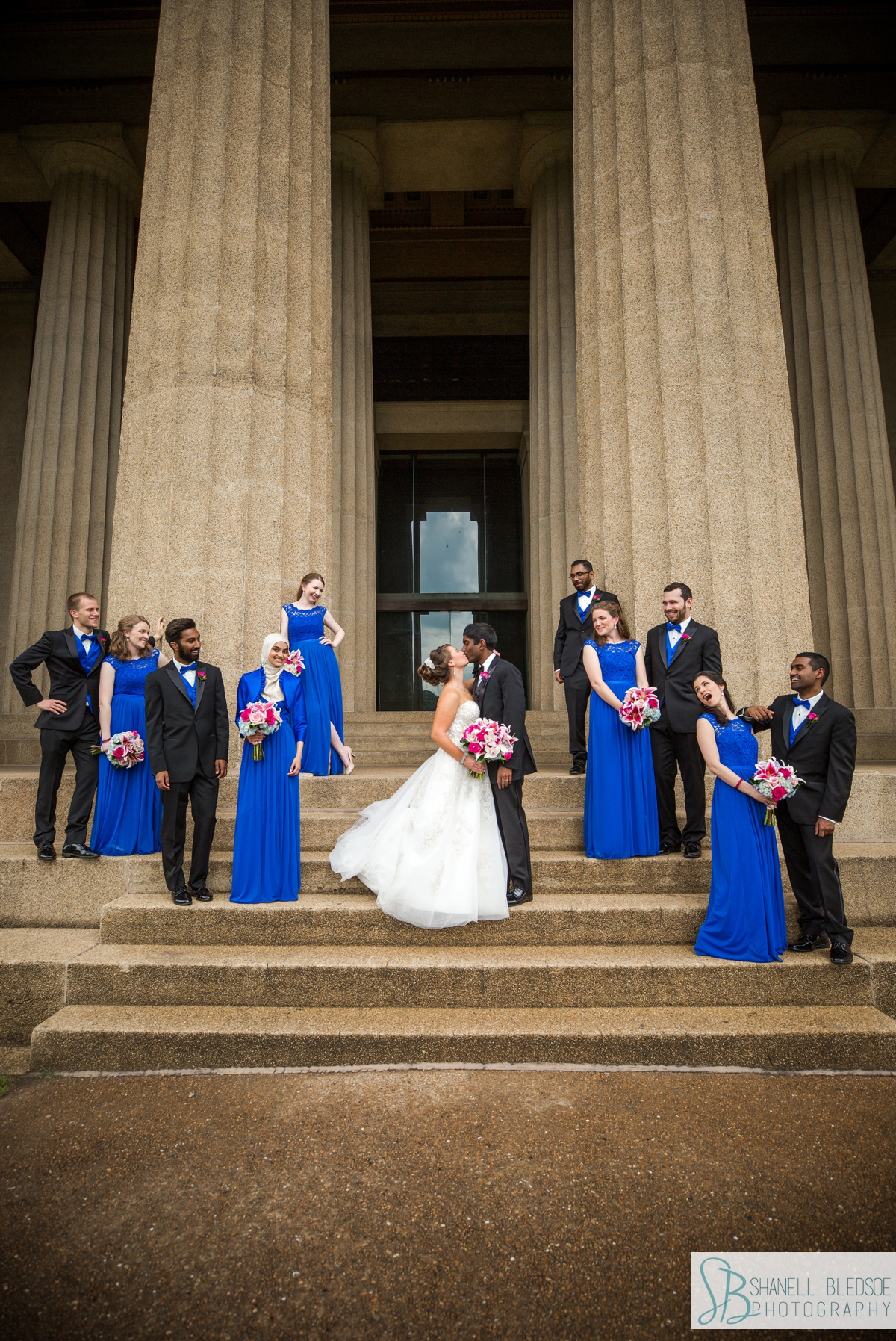 bride groom and royal blue wedding party on steps of the Parthenon in Nashville