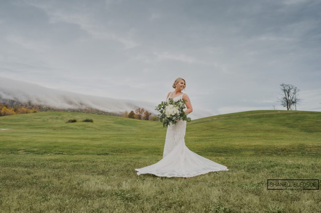 bridal portrait with fog rolling over east tennessee mountains at lafollette wedding