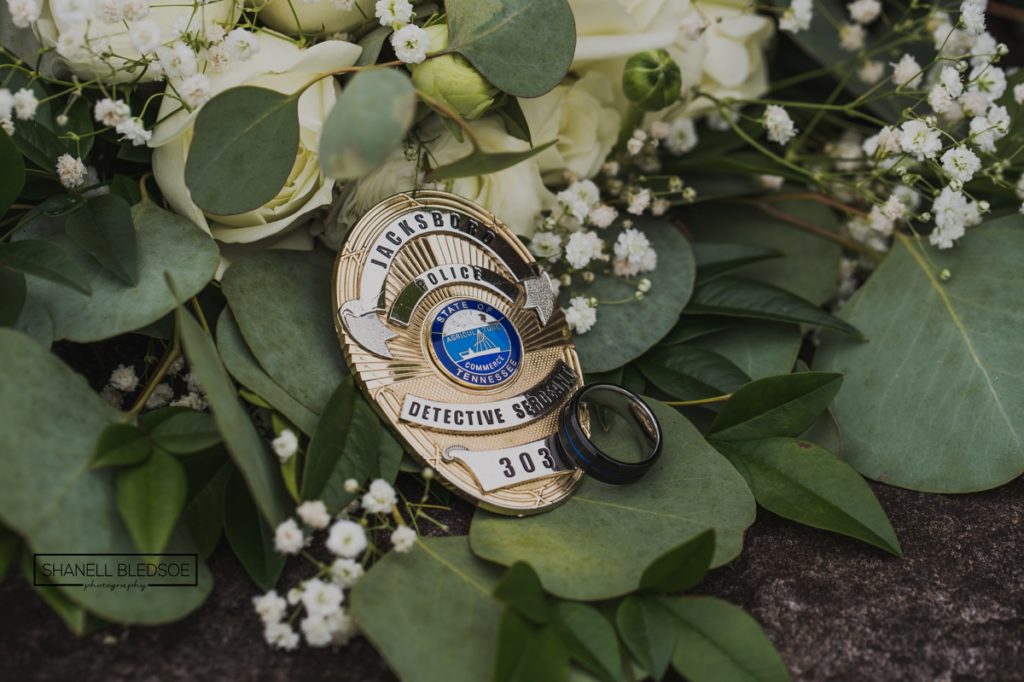 police wedding band and detective badge