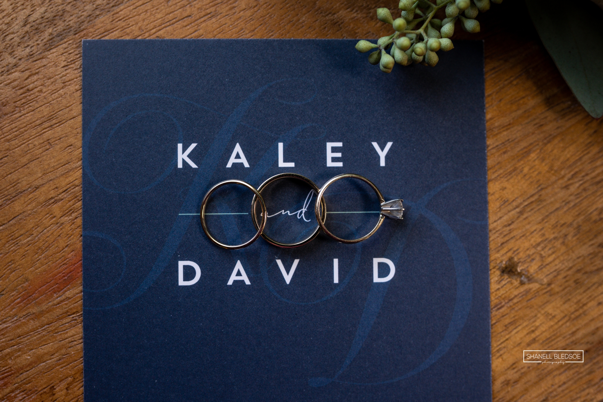 navy wedding invitation lay flat with rings
