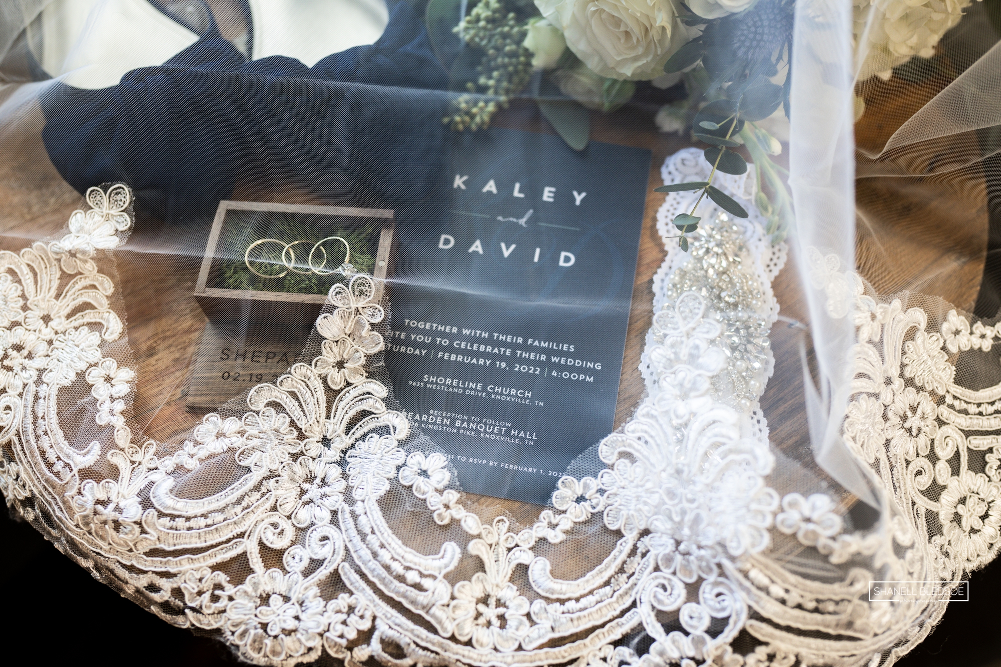 navy green lay flat wedding details with lace veil