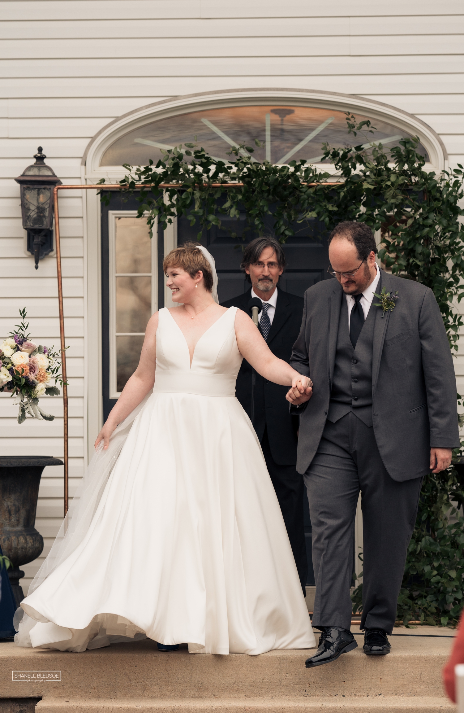 wedding ceremony on veranda of Harvest House at Lost Creek winery