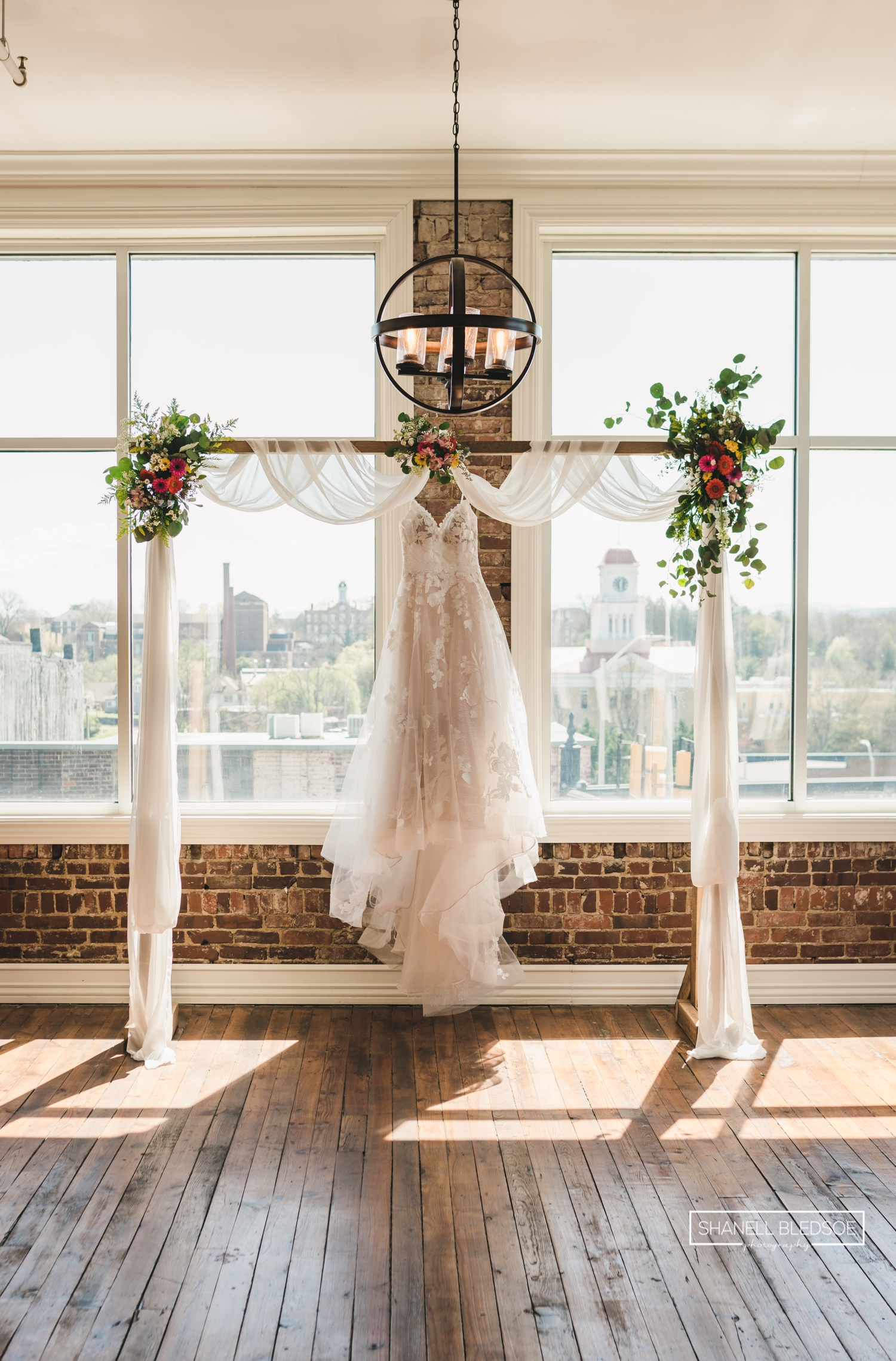 wedding dress hanging from arbor at downtown Maryville TN wedding