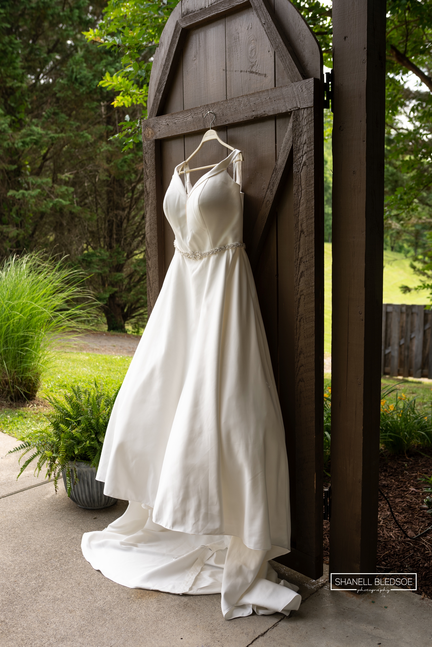 wedding dress hanging on door at Willow Ridge Event Center Townsend